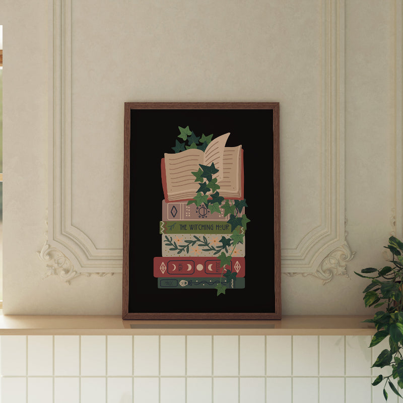 Framed artwork of books and ivy on a wall with decorative molding.
