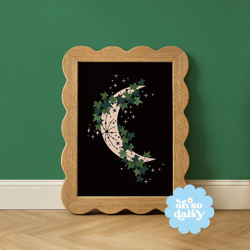 Framed artwork of a moon and stars design on a black background, with 'oh so daisy' logo in the corner.