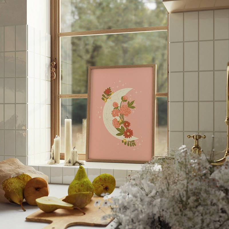 Decorative floral crescent moon print on a pink background in a bathroom setting.
