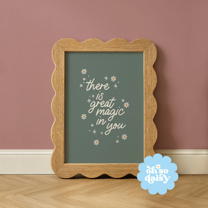 Framed artwork with motivational quote on a wall, featuring 'oh so daisy' brand.