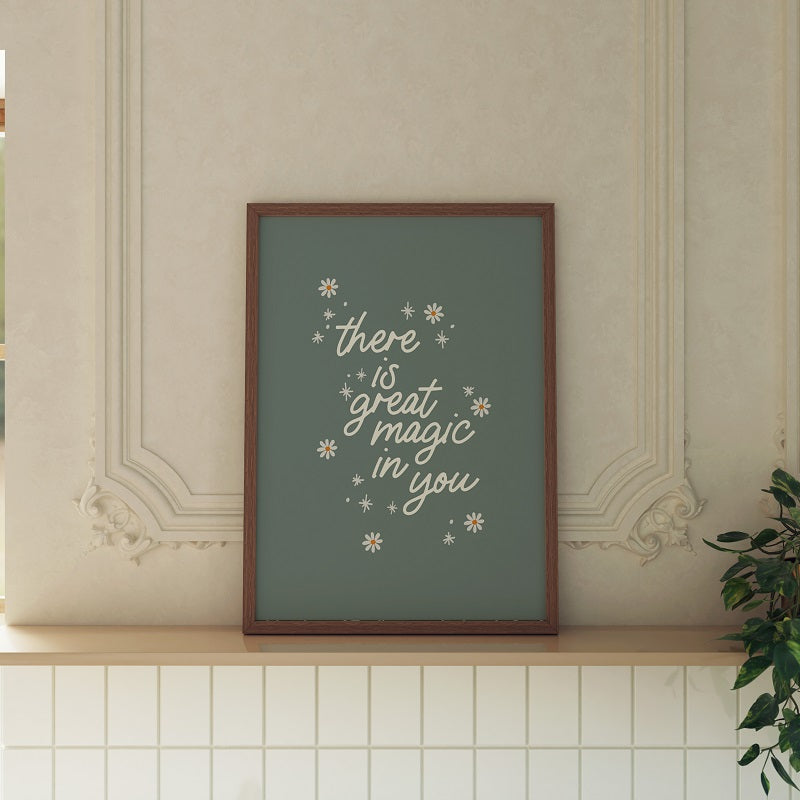 Framed print with motivational quote on a wall shelf