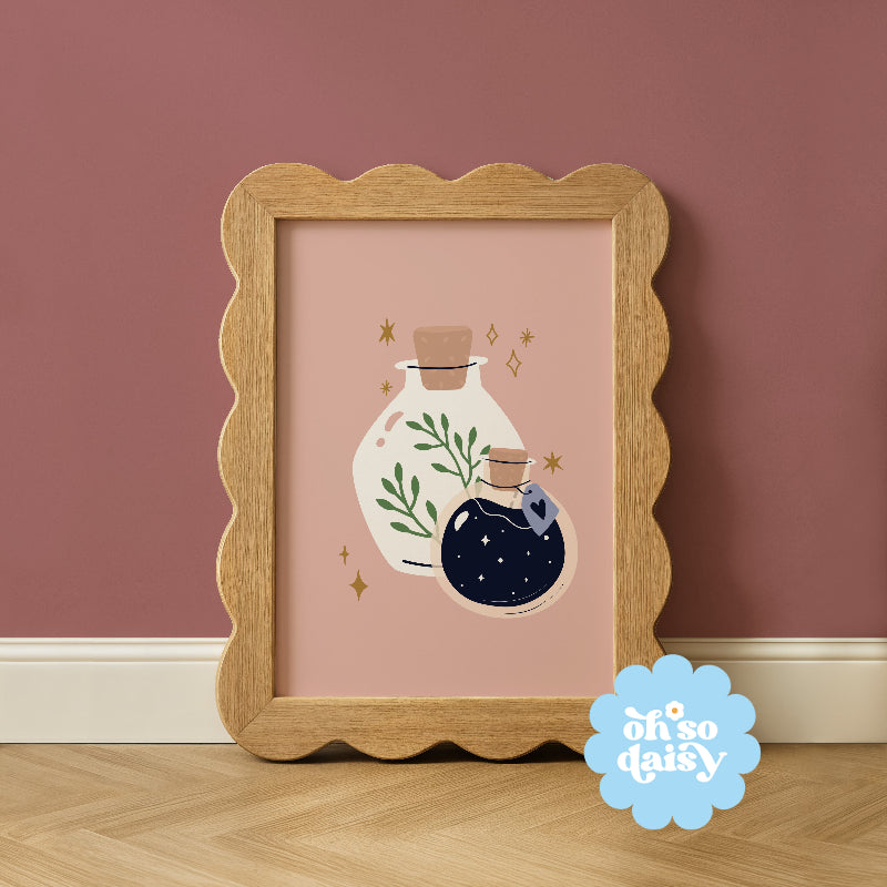 Framed artwork with decorative bottles on a pink background, featuring 'oh so daisy' logo.
