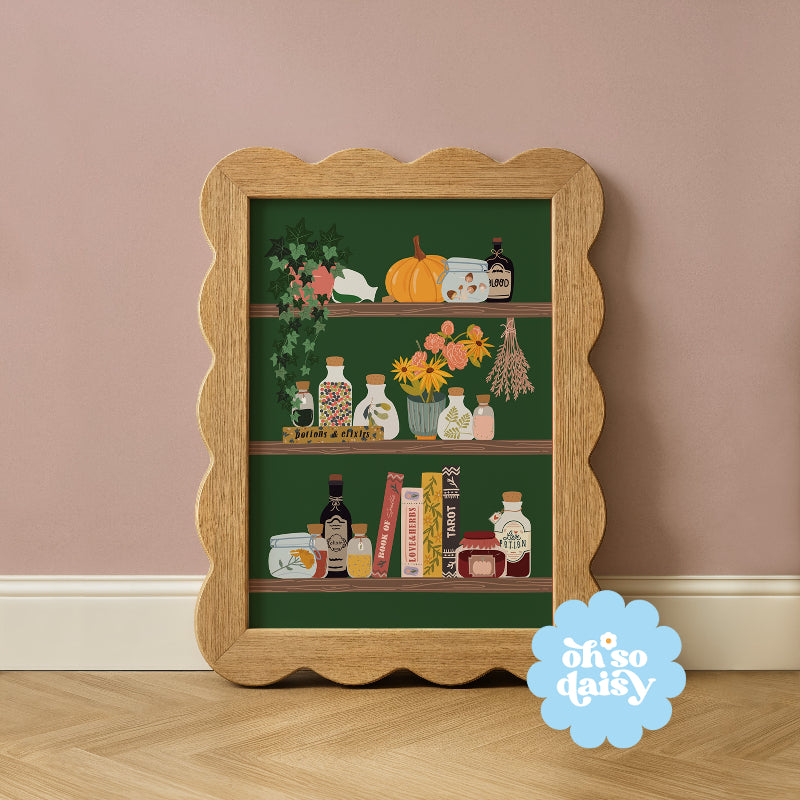Decorative shelf print with a wooden frame on a wall, featuring 'oh so daisy' branding.