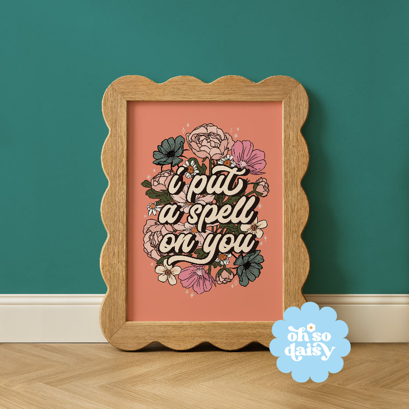 Framed artwork with floral design and text on a teal wall