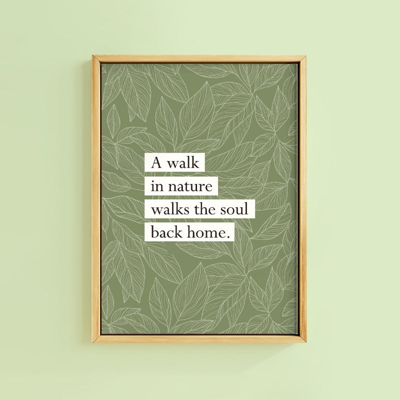 Framed print with leaf pattern and motivational quote on a light green wall