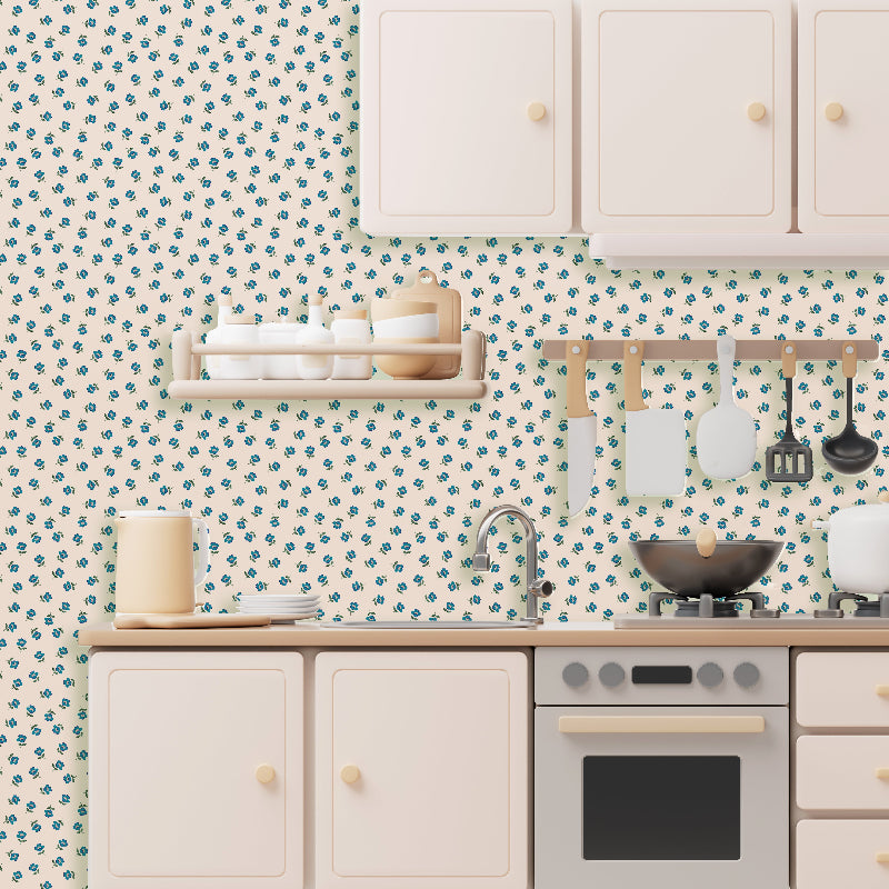 Kitchen with floral wallpaper and white cabinets