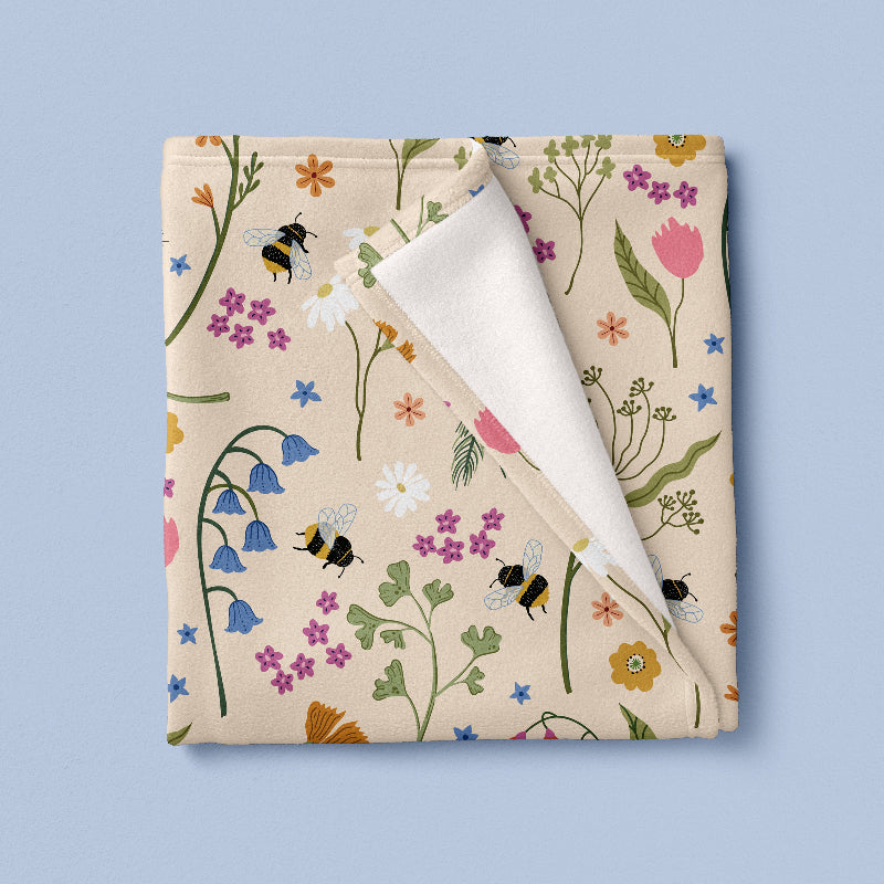 Floral fabric with bees and flowers on a beige background