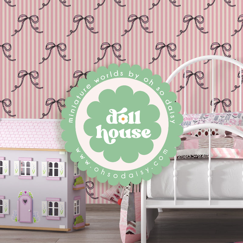 Dollhouse with a bed and decorative elements against a wallpapered wall.
