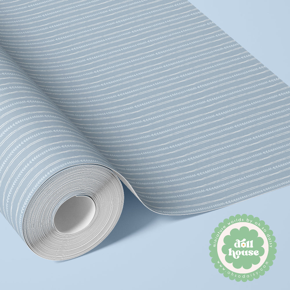 A roll of wallpaper with a light blue and white hand-drawn stripe pattern, shown partially unrolled on a light blue background with a green 'dòu house' brand logo in the bottom right corner.