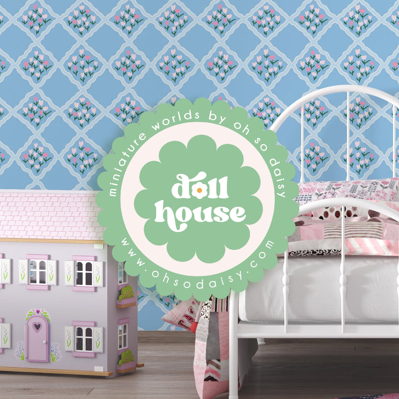 Dollhouse with 'oh so daisy' branding against a decorative wallpaper.