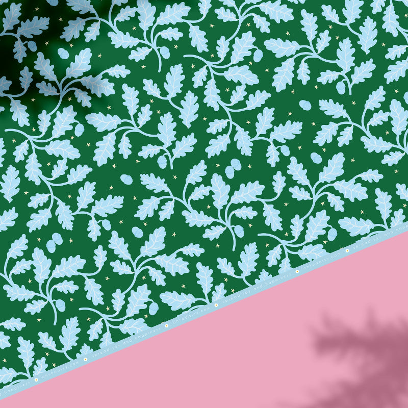 Say hello to Acorn Oak gift wrap. Featuring bright blue oak leaves and acorns scattered across a cheerful green background, sprinkled with twinkling hand-drawn stars, this gift wrap is full of festive charm and whimsy. Perfect for mixing and matching with our floral Hollyhock prints or wavy candy cane stripes, it’s a joyful way to make your gifts feel extra special this Christmas.