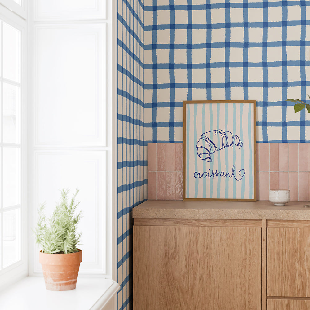 Cottage gingham hand painted wallpaper in cornflower blue styled up close in a modern kitchen with a country cottage feel