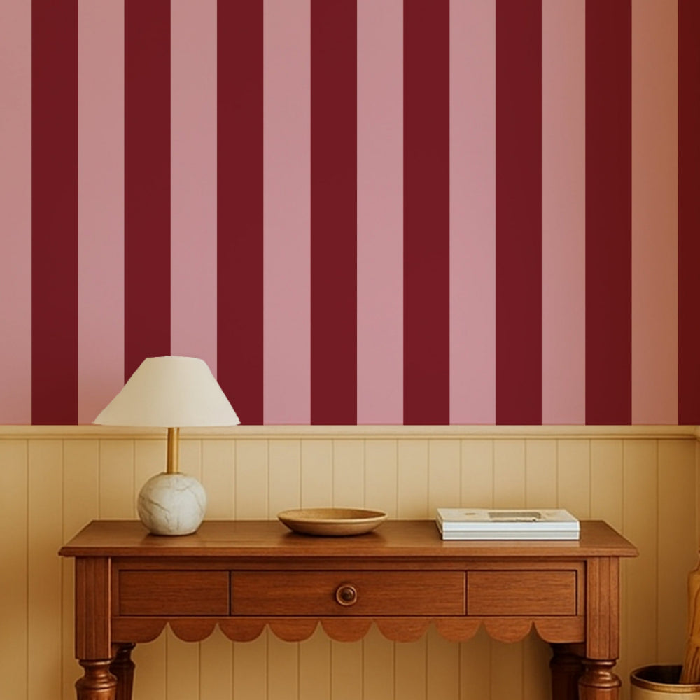 Stately stripe burgundy red and sugar pink wallpaper in a soft feminine boho entry hall way