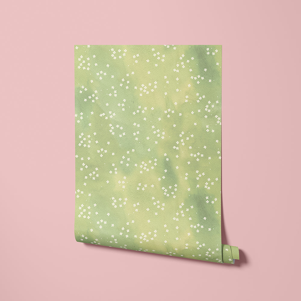 Meadow Mist green floral wallpaper with small daisy print shown across a softly blended background, highlighting the subtle texture and pattern